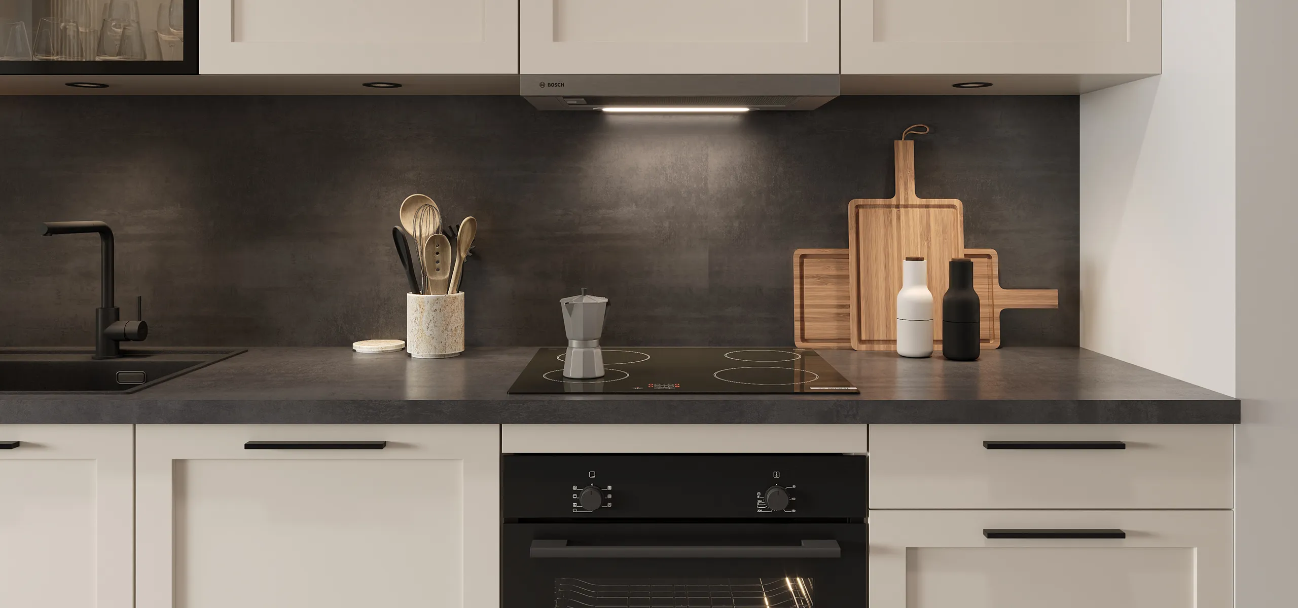 Detailaufnahme einer modernen Küchenzeile mit eleganter Kombination aus hellen Rahmenfronten und dunkler Arbeitsplatte.